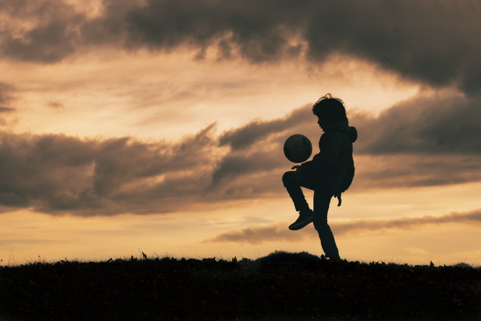 Child-in-silhouette-dribbles-and-plays-w-1074104.jpg